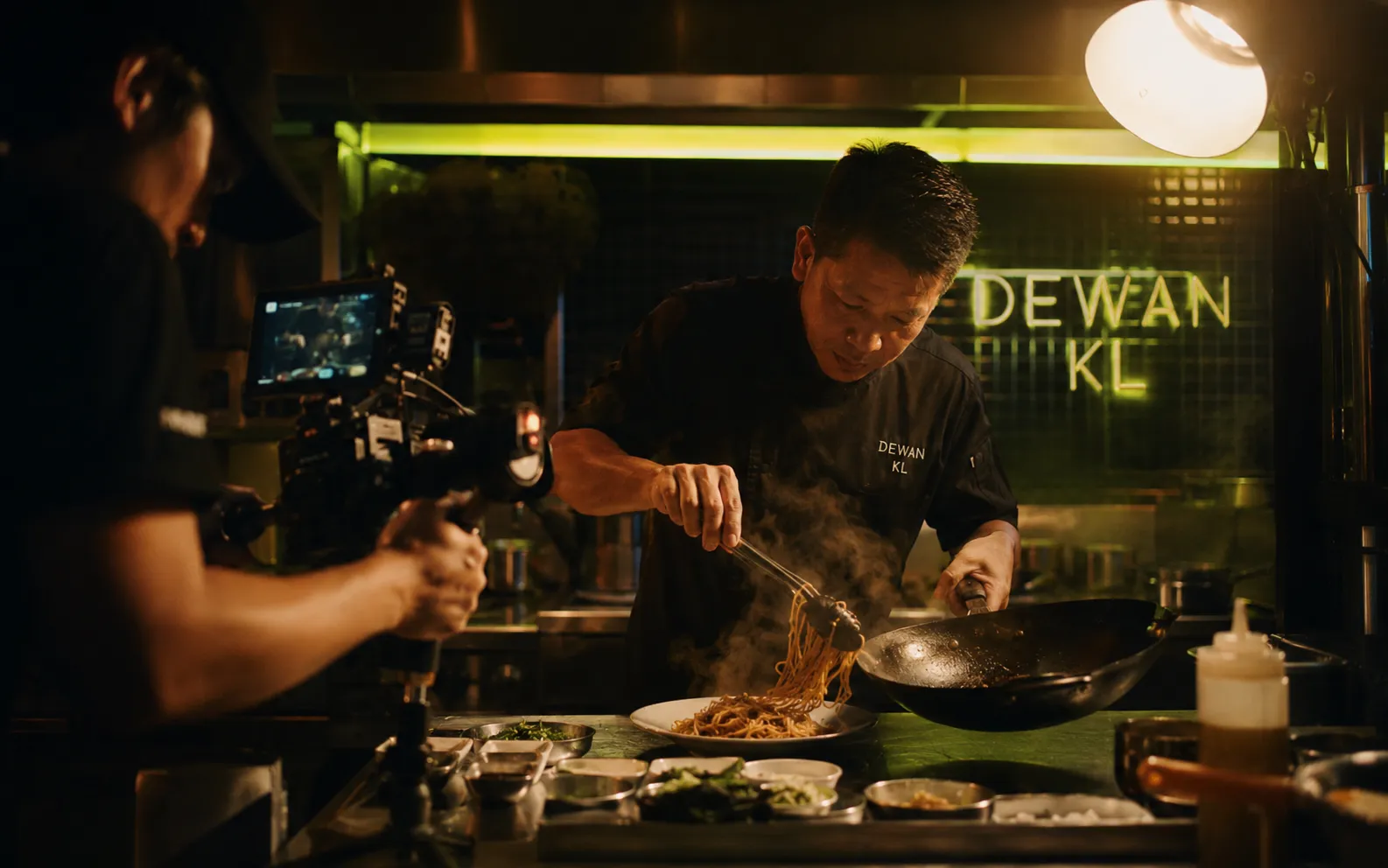 Behind-the-scenes video production shoot in a Kuala Lumpur restaurant kitchen